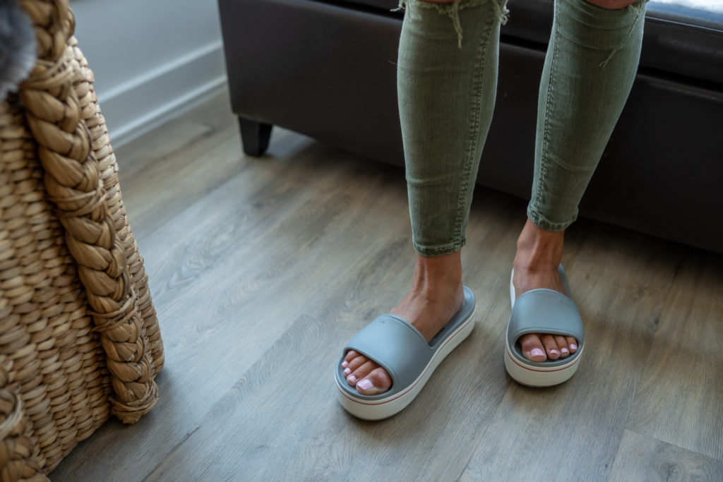 Women's feet wearing Crocs